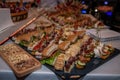 Food tray with delicious salami, pieces of sliced ham, sausage, yellow cheese Royalty Free Stock Photo