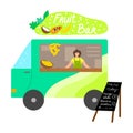 Food truck with fresh fruit bar, menu with written positions and smiling seller