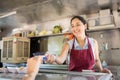 Food truck owner receiving payment Royalty Free Stock Photo