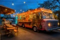 food truck with string lights and outdoor seating