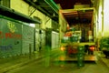 Food truck unloading boxes at night in a local market.