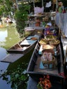 Female food vendor on her boat at floating market