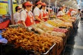 Food vendors at the Donghuamen Night Market near Wangfujing Street in Beijing, China