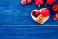 Food which help heart stay healthy. Vegetables, fruits, nuts in heart shaped bowl on blue wooden background top view Royalty Free Stock Photo