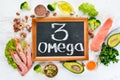 Foods containing omega 3. Vitamin Healthy foods: avocados, fish, shrimp, broccoli, flax, nuts, eggs, parsley. Top view. Royalty Free Stock Photo