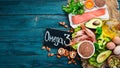 Foods containing omega 3. Vitamin Healthy foods: avocados, fish, shrimp, broccoli, flax, nuts, eggs, parsley. Top view. Royalty Free Stock Photo