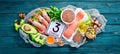 Foods containing omega 3. Vitamin Healthy foods: avocados, fish, shrimp, broccoli, flax, nuts, eggs, parsley. Top view. Royalty Free Stock Photo