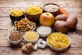 Foods high in carbohydrate on rustic wooden background Royalty Free Stock Photo