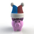 Fool hat on pink piggy bank isolated on white background Royalty Free Stock Photo