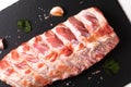 Foos concept organic raw pork ribs on black slate board with copy space Royalty Free Stock Photo