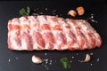 Foos concept organic raw pork ribs on black slate board with copy space Royalty Free Stock Photo