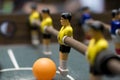 Foosball game yellow team close up Royalty Free Stock Photo