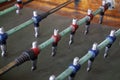 Foosball. Soccer hall game. Traditional game. Soccer game. Table with soccer players. Old wooden foosball. Football players. Dolls Royalty Free Stock Photo