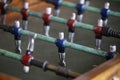 Foosball. Soccer hall game. Traditional game. Soccer game. Table with soccer players. Old wooden foosball. Football players. Dolls Royalty Free Stock Photo