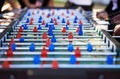 Foosball table, competitive and leisure with people playing a game outdoor at a music festival together. Party, event or Royalty Free Stock Photo