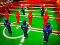 Foosball. Table with red and blue players detail perspective. Royalty Free Stock Photo