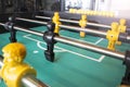 Foosball Table Soccer Game black and yellow players Royalty Free Stock Photo