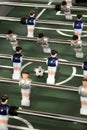 Foosball table or table soccer and players Royalty Free Stock Photo