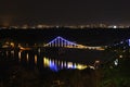 Foot bridge illuminated as a central part of night Kiev