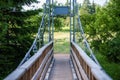 foot bridge over forest river in summer Royalty Free Stock Photo