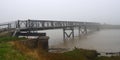 Foot Bridge over the River Blyth in the Fog. Royalty Free Stock Photo