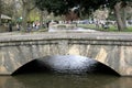 A foot bridge over the River Windrush at Bourton on the Water in Gloucestershire in the UK Royalty Free Stock Photo