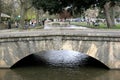 A foot bridge over the River Windrush at Bourton on the Water in Gloucestershire in the UK