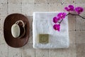 Foot care concept with pumice stone, Alep soap and white towel, flat lay