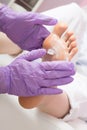 Foot care massage with cream. Pedicure SPA procedure Royalty Free Stock Photo