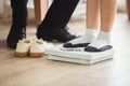 Foot child girl wear socks on weighing machine