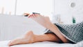 Foot hygiene barefoot woman lying bed legs Royalty Free Stock Photo