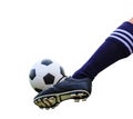 Foot kicking soccer ball isolated Royalty Free Stock Photo