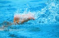 Swimming and kicking water splash in the pool Royalty Free Stock Photo