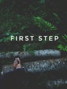 foot leg with hiking trekking sandal stepping on a pile of wood logs inside jungle forest Royalty Free Stock Photo