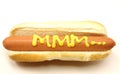 Foot Long Hot Dog with MMM... written in mustard.