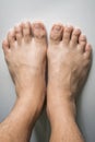 The foot and long nail toes on white concrete background. Long n Royalty Free Stock Photo