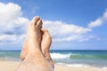 Foot lying on the beach Royalty Free Stock Photo