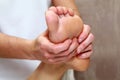 Foot massage close-up. Patient receiving foot massage. Royalty Free Stock Photo