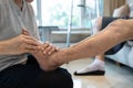 Foot massage physical therapy to relieve muscle spasms,massage the tired muscles of senior woman,feet numb from diabetes,old Royalty Free Stock Photo