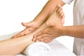 Foot massage, spa foot oil treatment in white background Royalty Free Stock Photo