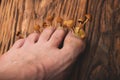 Foot with mushrooms on the nail plate on a wooden background. Concept of fungal diseases of the nails and skin of the feet,