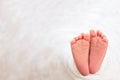 Foot of the newborn baby, peeling skin, fingers, maternal care, love and family hugs, tenderness. copy space, white background,