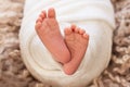 Foot of the newborn baby, peeling skin, fingers, maternal care, love and family hugs, tenderness. copy space, white background,