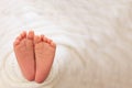 Foot of the newborn baby, peeling skin, fingers, maternal care, love and family hugs, tenderness. copy space, white background,