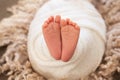 Foot of the newborn baby, peeling skin, fingers, maternal care, love and family hugs, tenderness. copy space, white background,