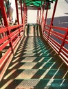 Red foot over bridge shadow Royalty Free Stock Photo