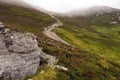 Foot path in a mountains with people walking up. Low cloudy sky. Croagh Patrick, Westport, county Mayo, Ireland, Travel and Royalty Free Stock Photo