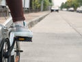 Foot on pedal of bicycle ready for departure