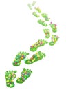 Foot print made of green grass and flowers Royalty Free Stock Photo