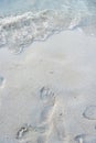 Foot print on sand at beach.Thailand Royalty Free Stock Photo